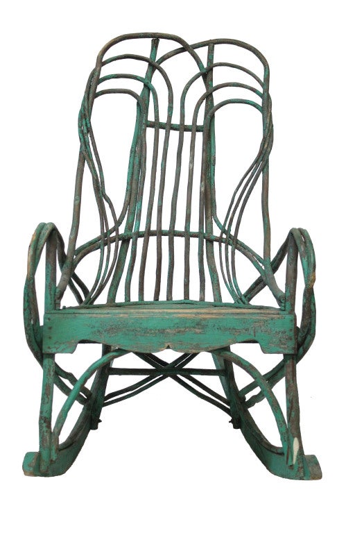 Handcrafted twig willow rocking chair with beautiful green patina. Very study base with wore slat seating.

*Not available for sale or to ship in the state of California.