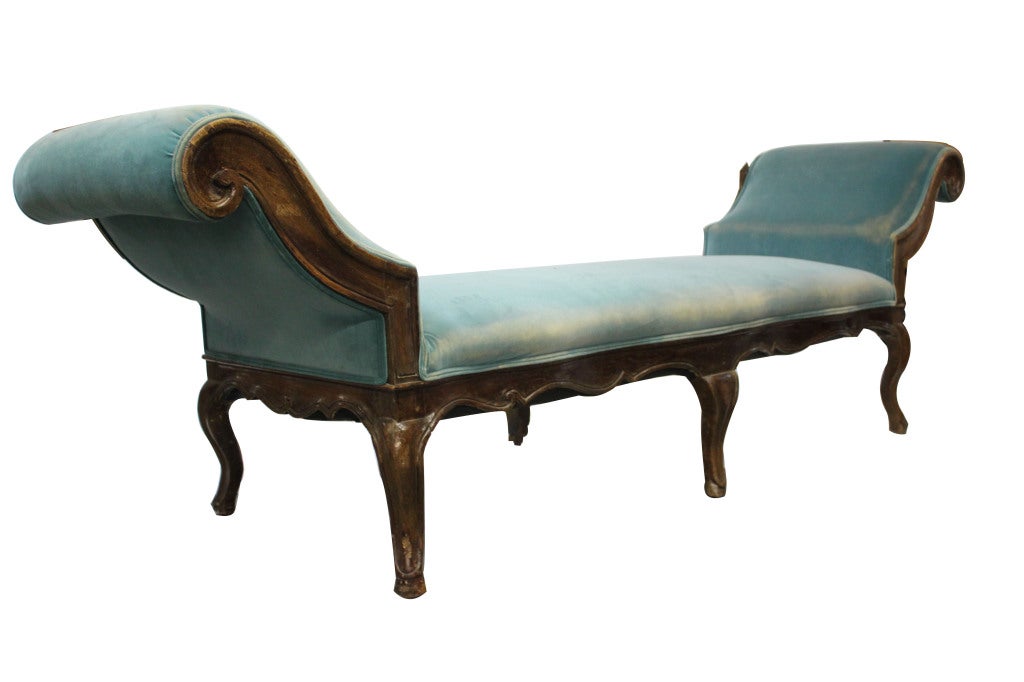 Louis XV style bench with scrolled arms and a serpentine front on cabriole legs and toupie feet. Covered in aqua velvet.

Not available for sale or to ship in the state of California.