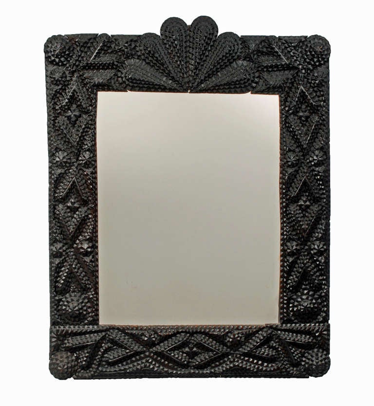 Not quite a pair but these two tramp art mirrors are similar and present crisp design elements. Both are embellished with numerous hearts and rossettes. The one that is topped with a fan is 1.5