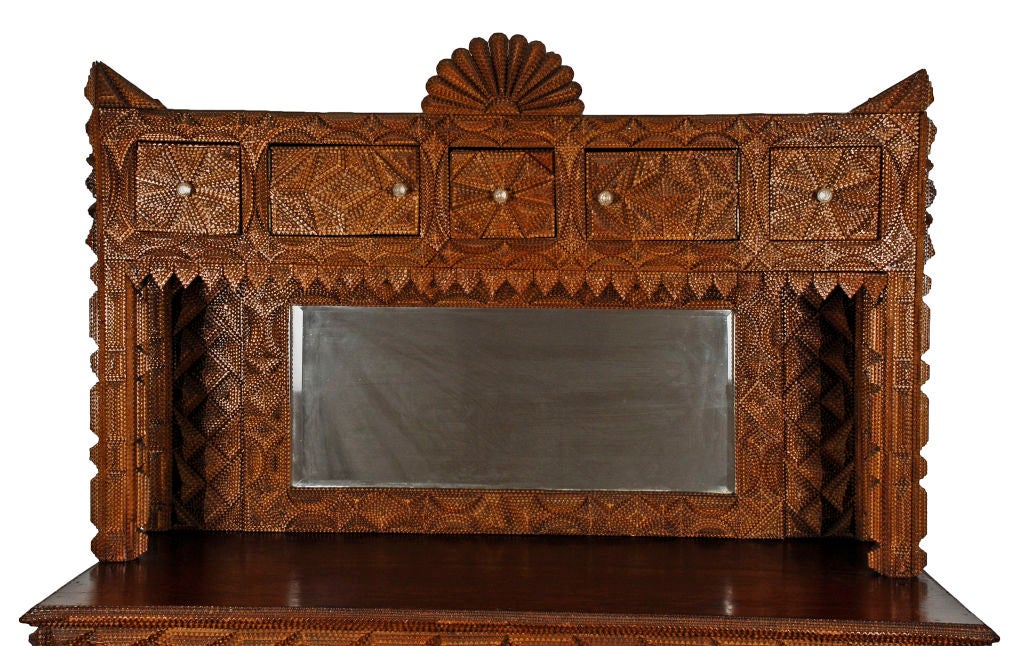 This masterful tramp art sideboard is one of the best and largest pieces of tramp art discovered. Grand in size and exquisitely detailed with hundreds of carved elements.  All scratch built out of crate woods and embellished with wooden cigar boxes