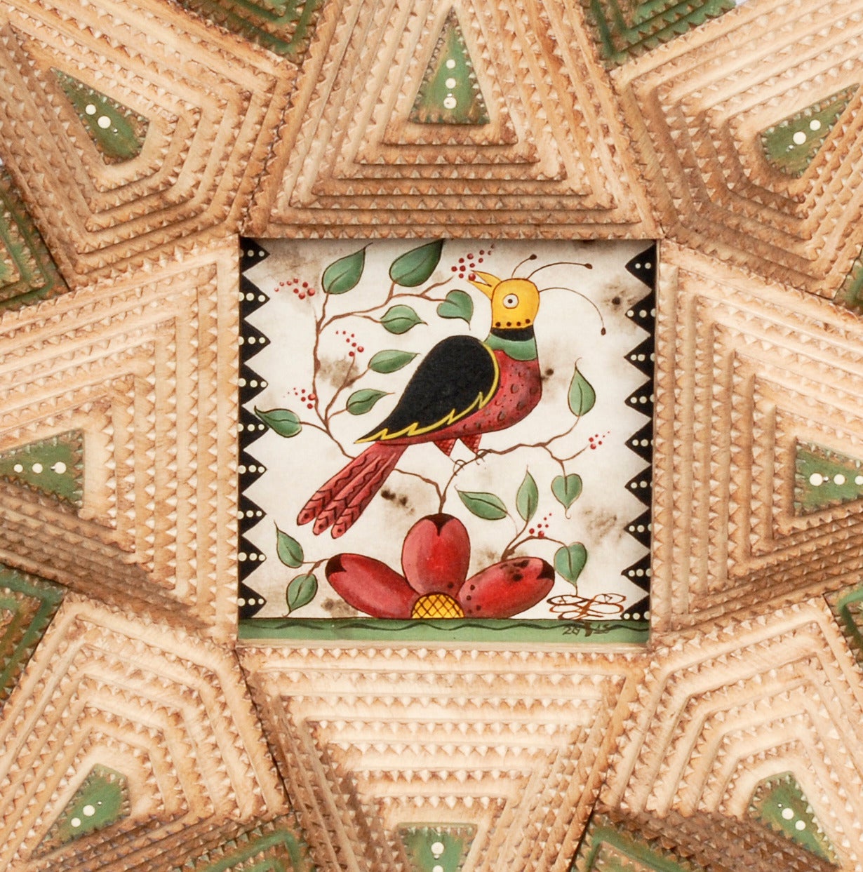 A lovely Tramp Art star-shaped frame by noted artist Angie Dow. The frame has a wonderful watercolor of a bird siting on a branch eating berries.