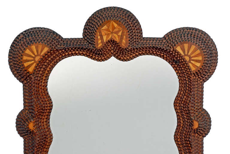 A wonderful tramp art and folk marquetry mirror with the inlaid name Thomas J Rogers on its bottom. It was made by a Rogers family member in appreciation of their famous relative, who was a Pennsylvania State Senator and a member of the U.S. House