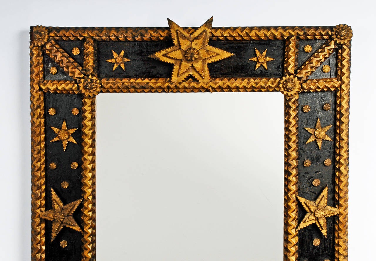 A nice large painted Tramp Art mirror embellished with gilded accents, stars and a heart. Made by Joseph Psait for his daughter Elanor Marie Psait on March 7, 1922. Found in Vienna, WV.