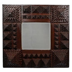 Robust Tramp Art Mirror with Bold Geometric Patterning