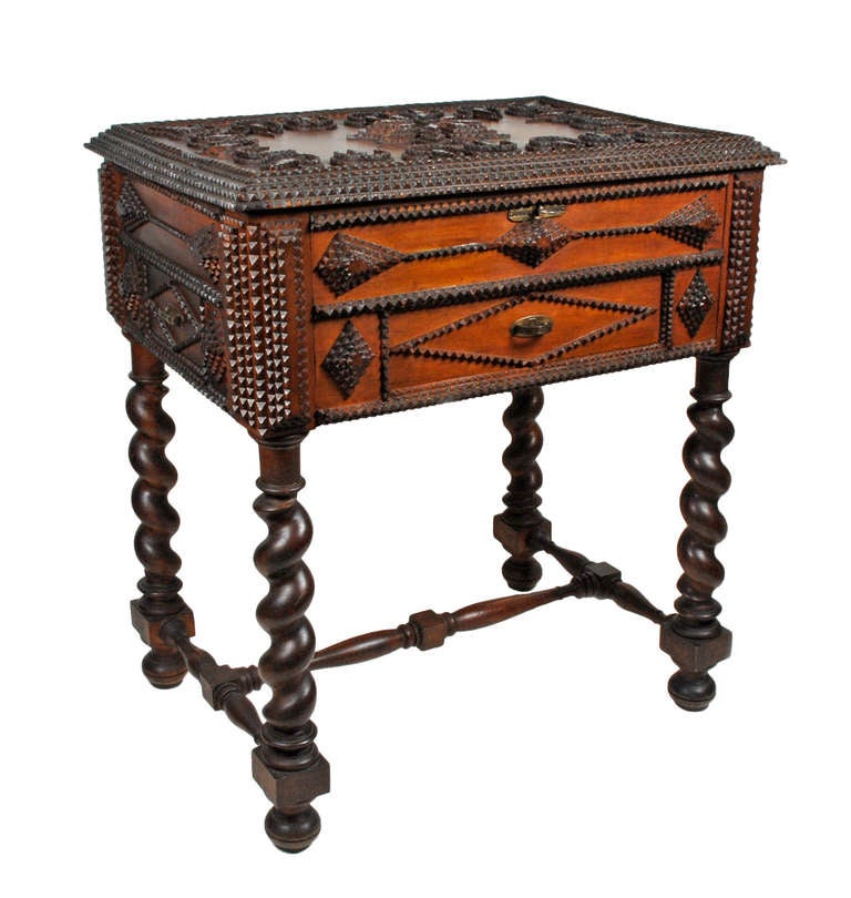Superb tramp art vanity on turned legs. Decorated with a large layered star on its top this wonderful piece of tramp art furniture has a formal look. Its top opens with a key and there are three dovetailed drawers one in the front and on both sides.