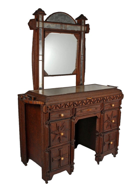 Extraordinary tramp art vanity with mirrors and drawers decorated with large stars. The top has a compartment accessed by a lift-top mirror and it stands on metal wheels. This full size folk art vanity is all made from scratch primarily from found