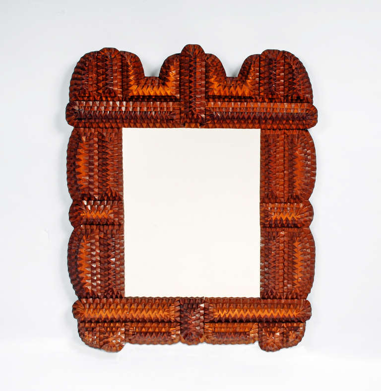 A nice bold tramp art mirror with curved edges. Circa 1920s - 1930s.