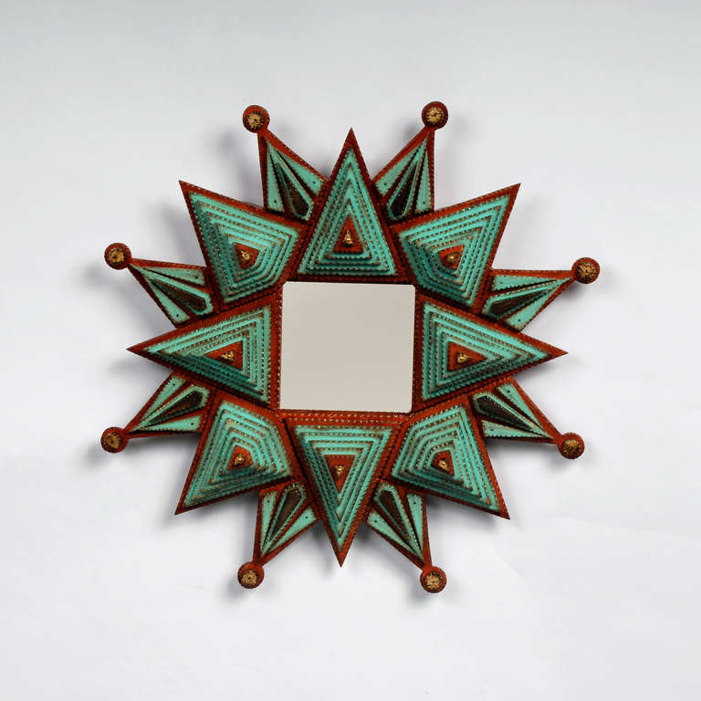 A fine tramp art starburst frame made by noted tramp artist Angie Dow.
