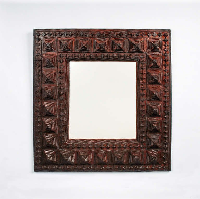 An impressive deeply layered tramp art mirror heavily embellished with geometric elements, circa 1880-1890, Winsted, CT, USA.
