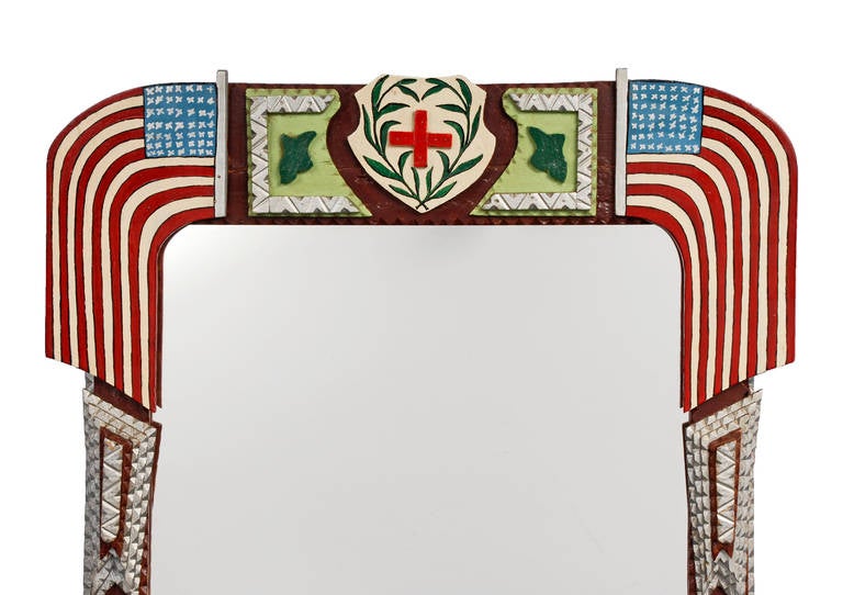 A fine inspired tramp art mirror with a patriotic theme with American flags draped on each side. The frame is attributed to Pietro Talleri, circa 1930 - 1940.