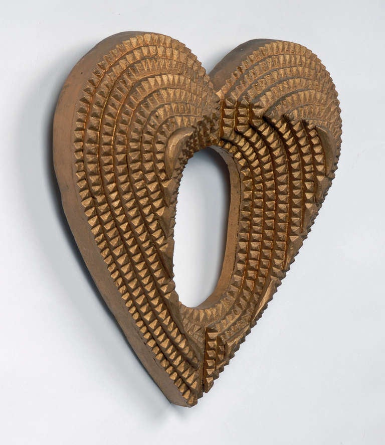 Fine tramp art gilded heart shaped frame.