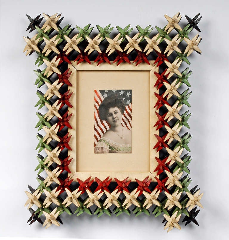Fine four color painted crown of thorns frame with a patriotic inspired photograph. Deeply carved and in sturdy excellent condition. From Coos Bay, Oregon and dates to 1900 - 1910.