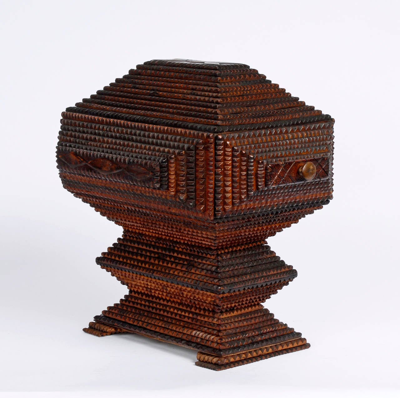 A fine Tramp Art deeply layered pedestal box with a drawer and delicate diamond embellishment. Exhibiting a superb sculptural presence,

circa 1890s-1900.