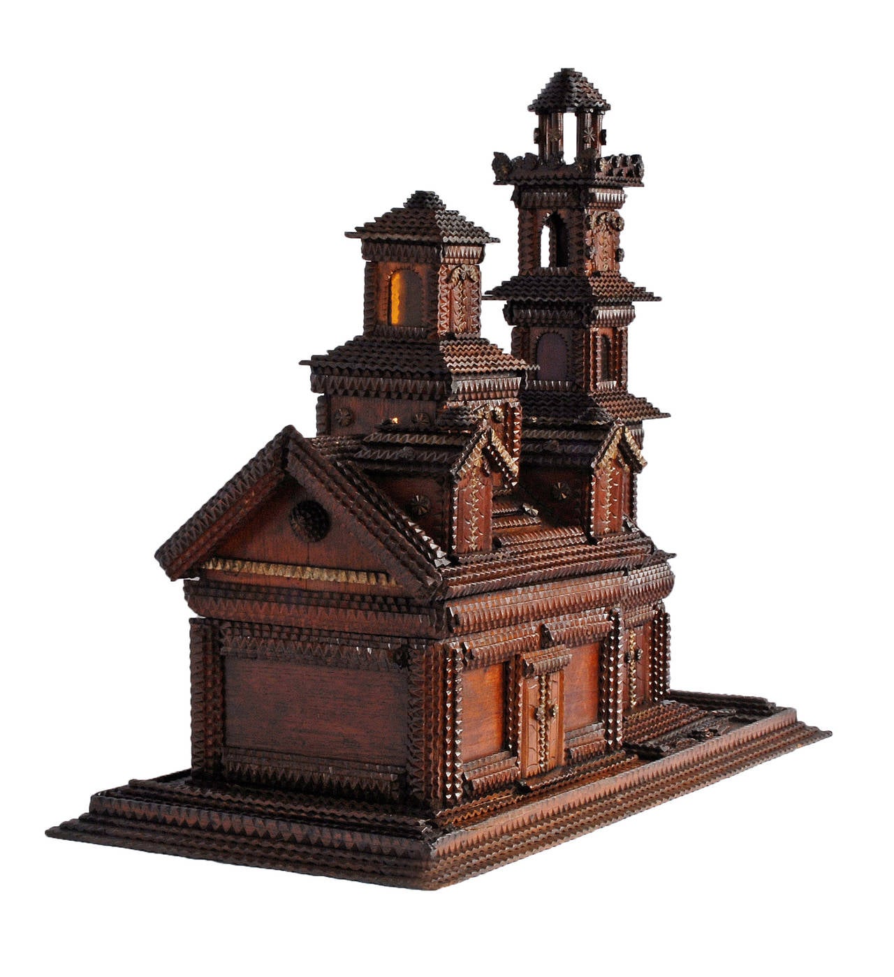 Fine Tramp Art house shaped jewelry box on a platform base with a Tramp Art tower. The house has working shutters, colored glass inserts, a door which shields a mirror, a slot for coins and has exquisitely carved details. The house lifts up to