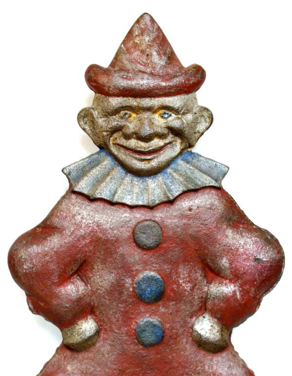 Clown shooting gallery target manufactured by H. L. Evans Company of Chicago, IL.<br />
Original red and blue paint over a silver primer.  Good surface that shows signs of<br />
minimal use.  Excellent whimsical face.  One of four variations that
