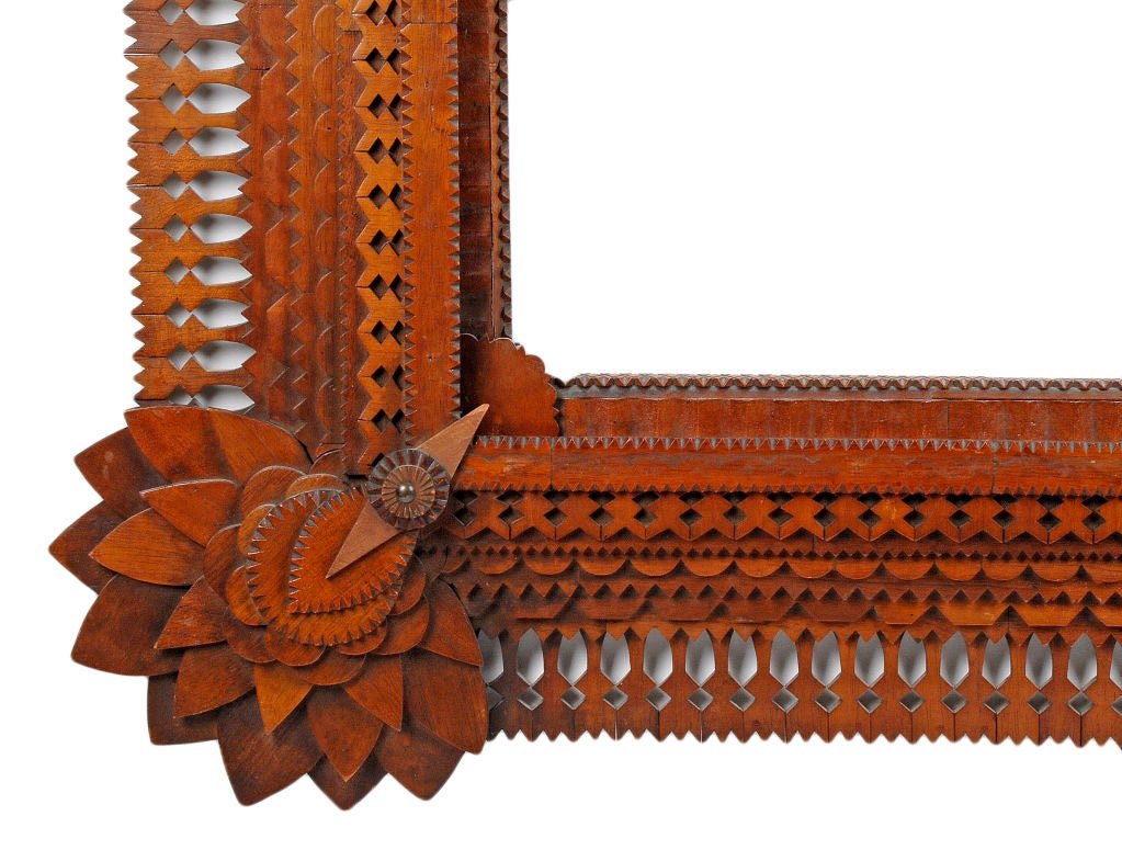 Masterwork tramp art sunflower corner frame made by noted tramp art artist John Zubersky.  Large & robust with fine detailed work this frame exhibits all of Zubersky's signature elements.  Big impressive sunflower corners anchor the frame with the