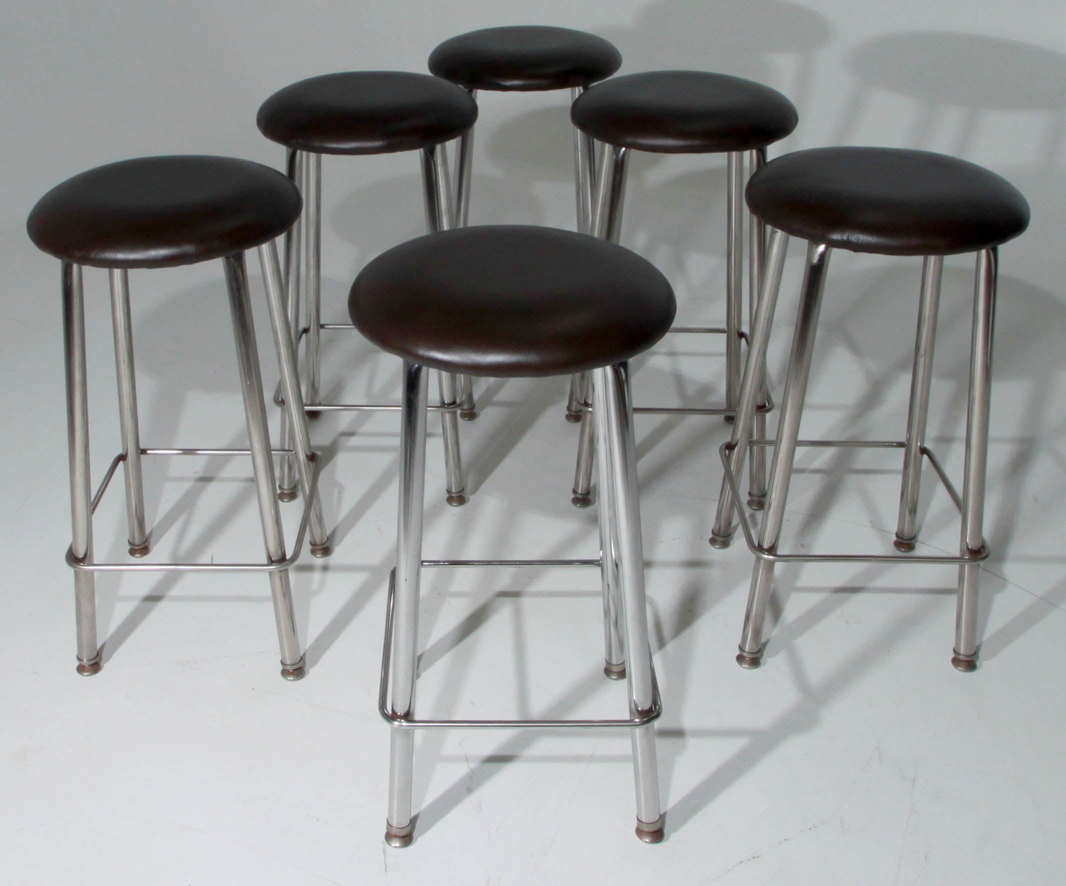 Set of Seven Chrome and Dark Brown Leather Button Stools For Sale