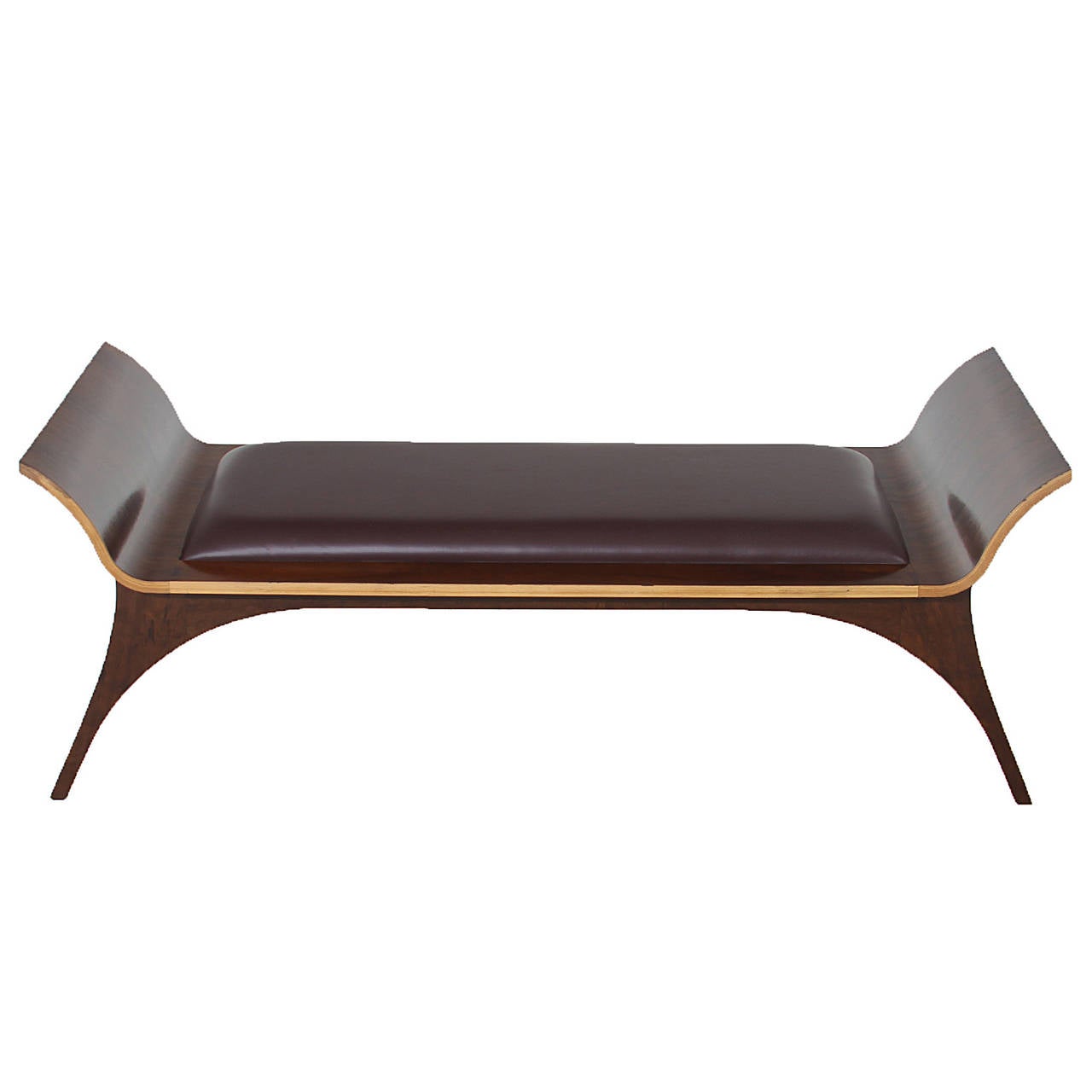 An elegant rosewood bench from Brazil. The seat is upholstered in a burgundy leather complimenting the red tones of the rosewood. The bench has a sculptural design with the curvaceous legs. 

Cushion size: 45