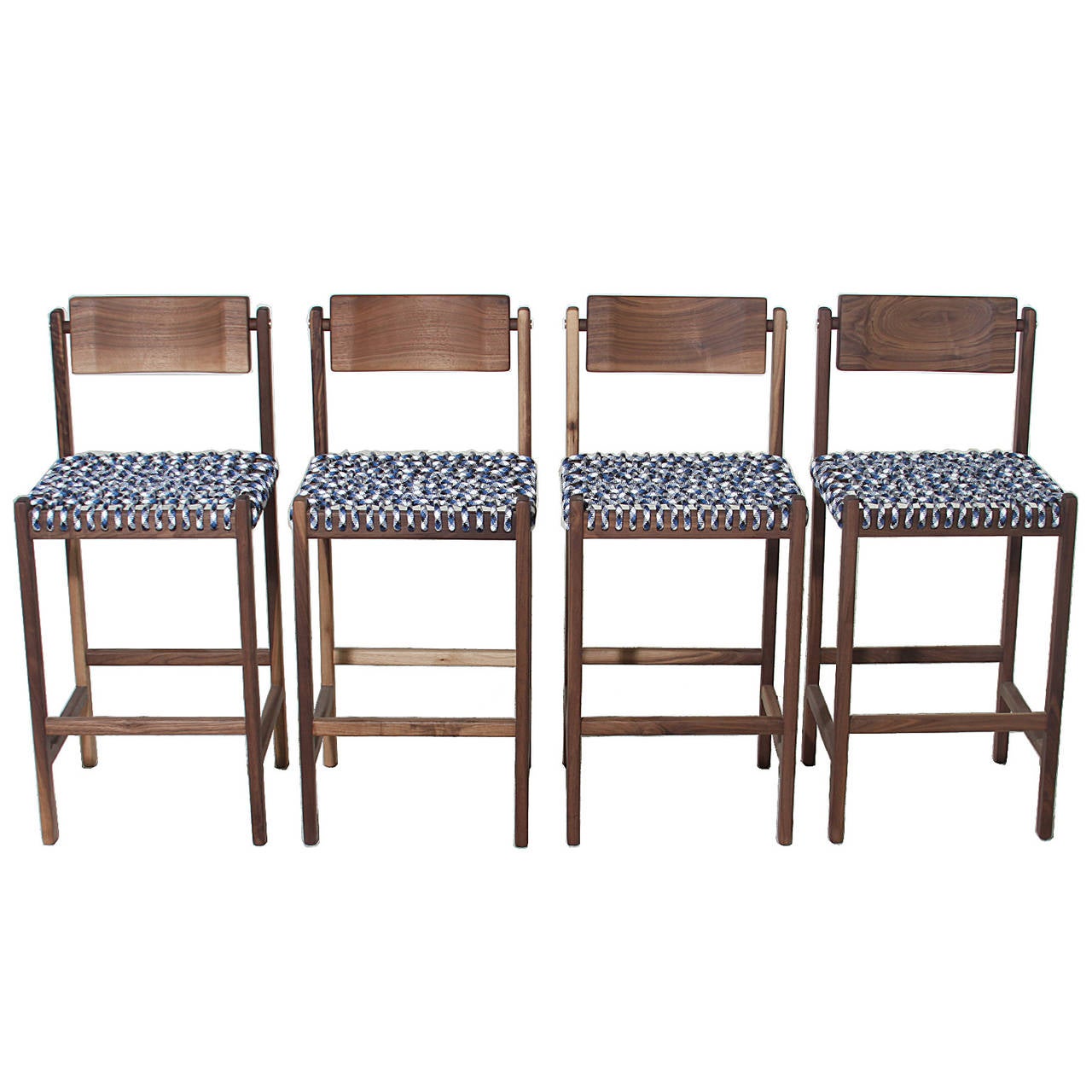 A sturdy solid Walnut stool with a seat of woven multicolored Paracord and back of carved solid Walnut that pivots for ultimate comfort. The frame has brushed brass details on the sides. 

Seat depth: 16