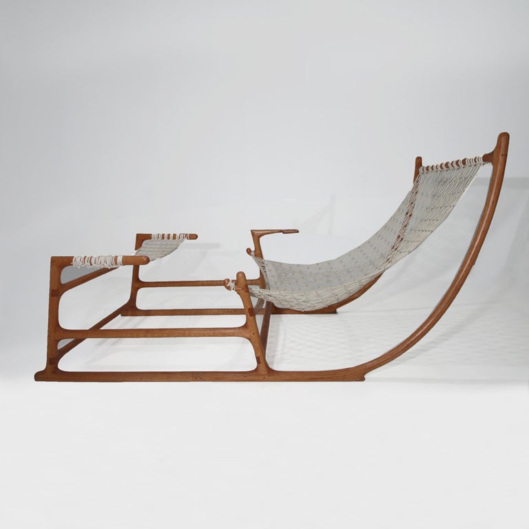 Red Oak and macramé hammock chair by artist-craftsman William C. Leete. This spectacular piece, which doubles as sculpture, is approximately six feet long and three feet high.  The curved pieces are laminated, which was an extremely labor-intensive