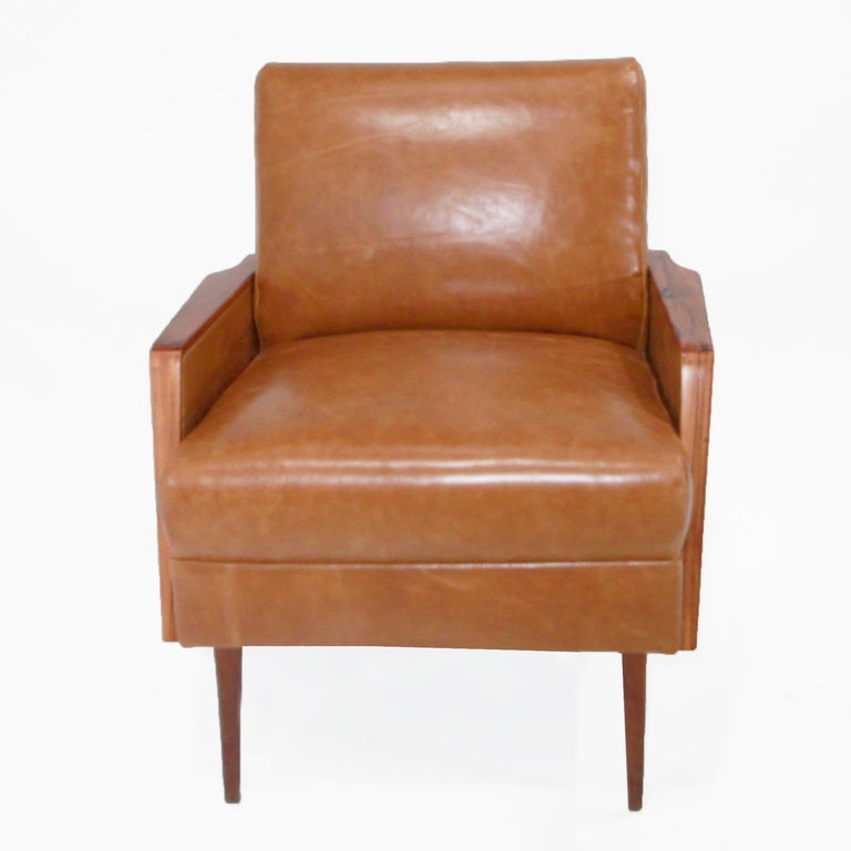 Pair of Rosewood and distressed caramel leather armchairs by Giuseppi