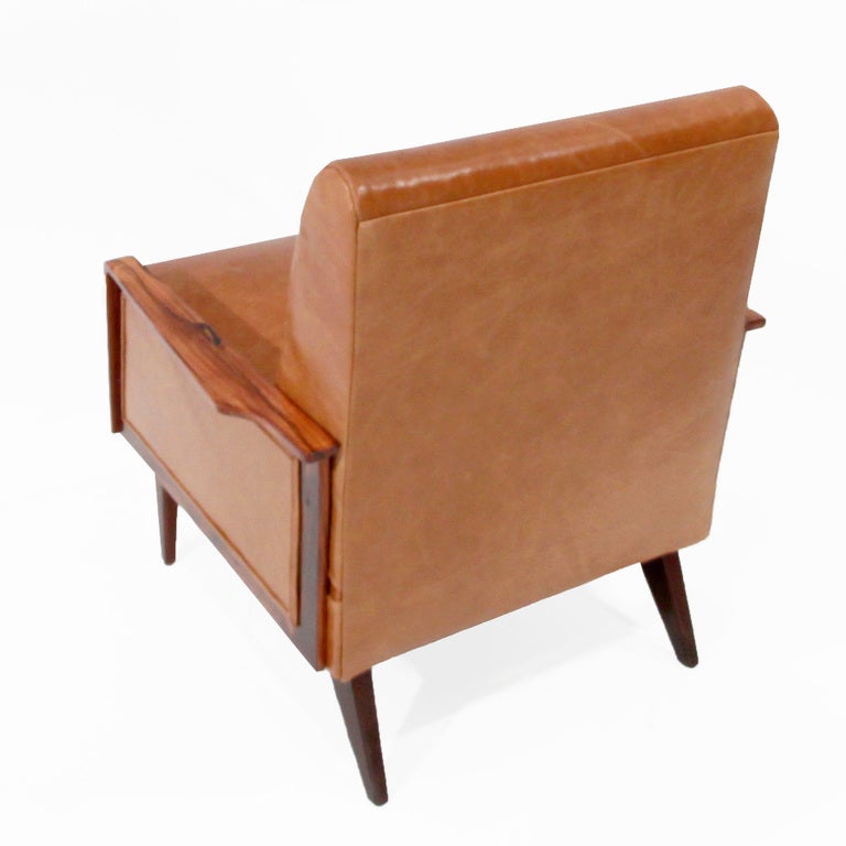Pair of Rosewood and distressed caramel leather armchairs by Giuseppi