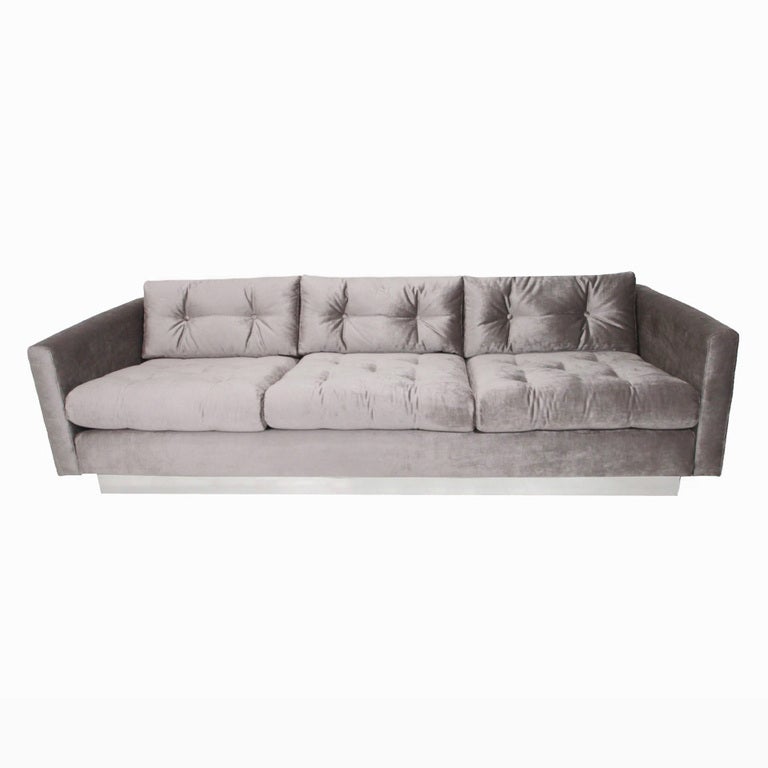 Milo Baughman tufted silver silk velvet and chrome base sofa. Seat depth measures 22