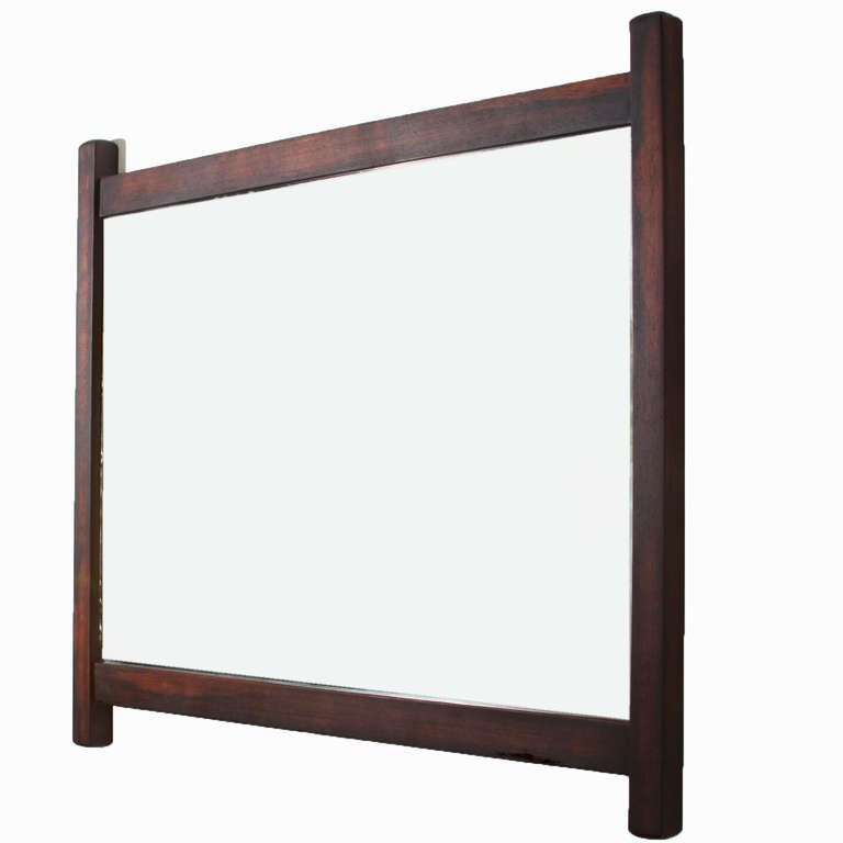 A beautiful large rectangular mirror by Sergio Rodrigues in exotic dark grain wood. This mirror is an early piece from the 1960s and has been refinished with a matte natural oil finish and hand rubbed. The brass accents were highly polished. 
 
     