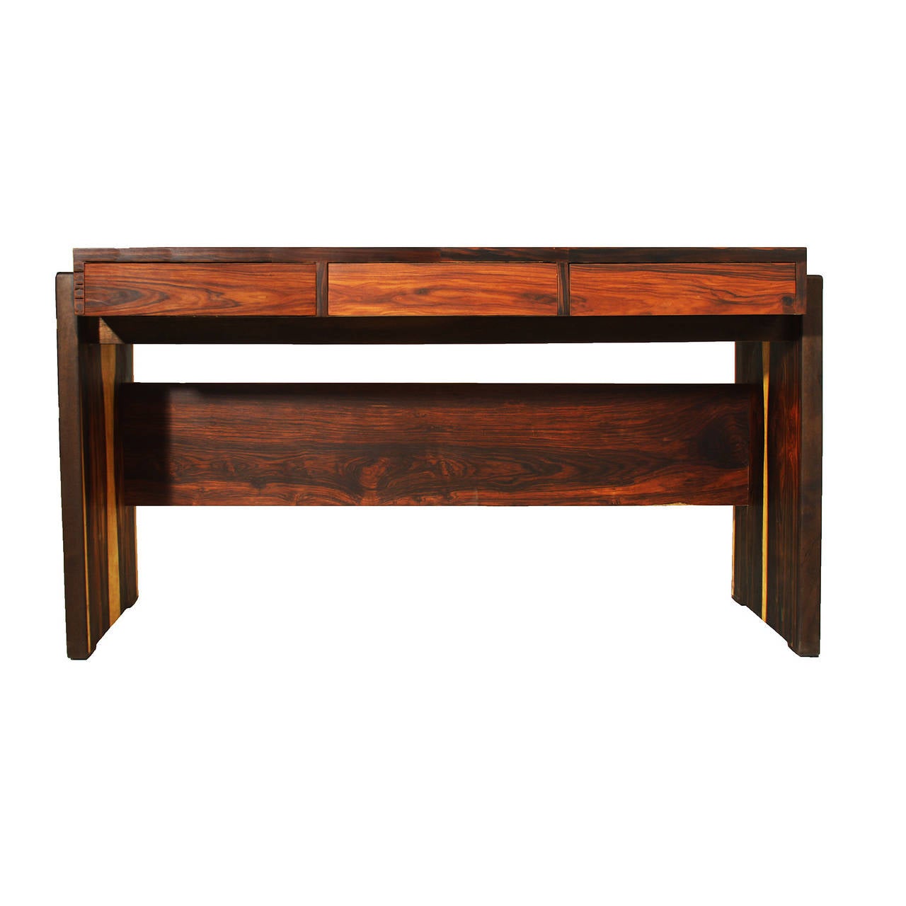 A stunning vintage rosewood desk by Joaquim Tenreiro. This piece has been finished in a rich hand rubbed oil finish and the wood is deep and rich as seen in photos.

 