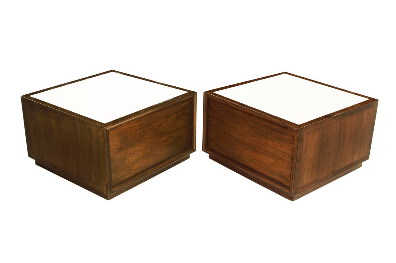 Walnut stained leather topped end tables with carved doors.

     