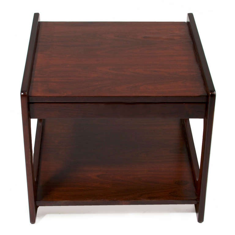 Exotic Brazilian hardwood side table with square cut-out, rounded edges, and a single shelf from Brazil.

 