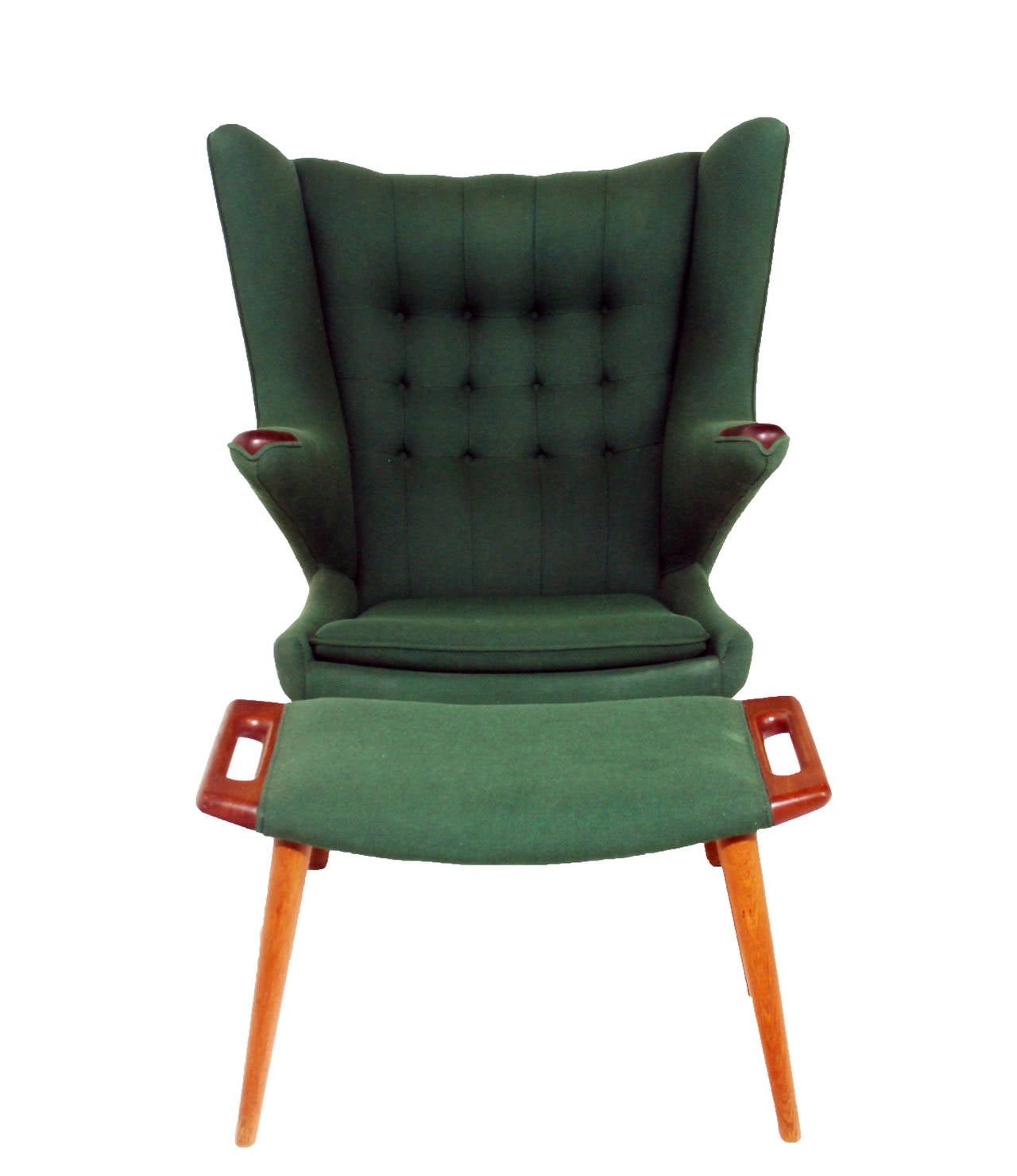 An all original Papa Bear Chair and Ottoman by Hans Wegner upholstered in a hunter green fabric. The frame is a variety of woods, oak and teak. 

Many pieces are stored in our warehouse, so please click CONTACT DEALER to find out if the pieces you