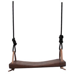 The Callais Swing in Walnut by Thomas Hayes Studio
