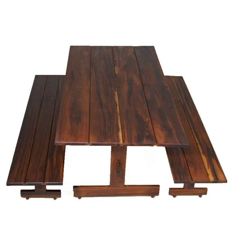A pair of stunning solid Imbuia benches with beautiful wood grain designed by Sergio Rodrigues for Oca. They fit well with dining tables. They have been refinished with a natural oil finish that is waterproof and silky smooth.

In order to