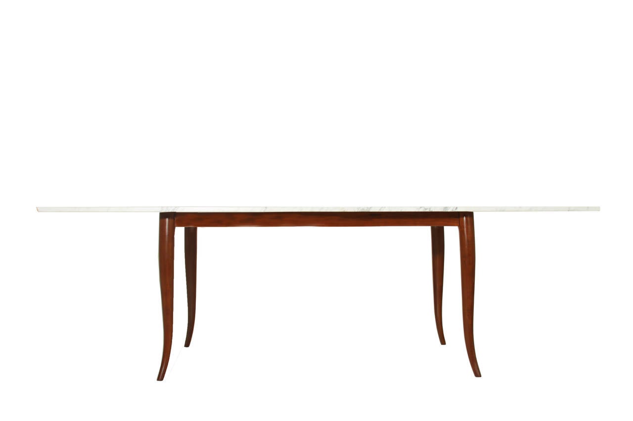 Sculptural Caviuna dining table with Carrara marble top. This table is in the manner of Giuseppi Scapinelli.

