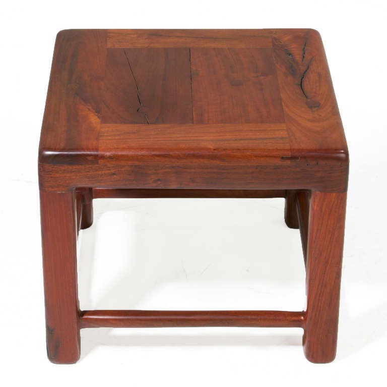 A small solid Ipe wood side table with rounded edges and large solid legs. The Ipe was salvaged from vintage railroad planks, and retains nail holes, cracks and variation in grain that only adds to the appeal of this unique table. 

  
 
 