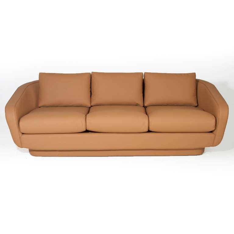 A vintage sofa redone in tan leather by Norman Fox Macgregor for Sam Belz of Memphis with curved arms. 

Seat depth=22.

Many pieces are stored in our warehouse, so please click on 