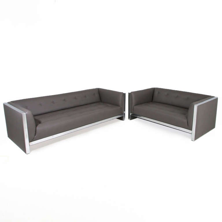 A small sofa or love seat in tufted gray leatherette with chrome accents by Milo Baughman. The chrome is original and has some wear, but it can be re-chromed.

Seat depth: 25

 