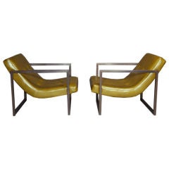 Pair of green leather and bronze arm chairs