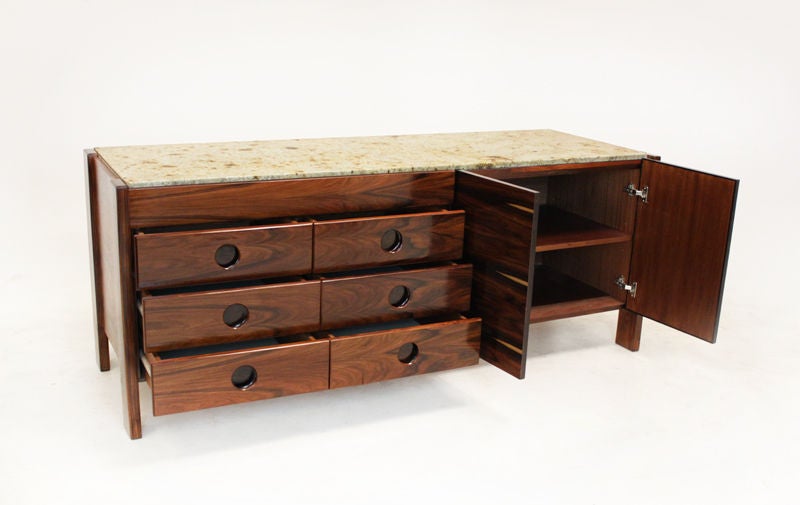 Mid-20th Century Brazilian credenza with solid rosewood legs and granite top.