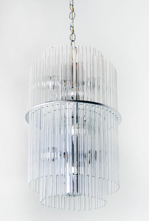 Two-tiered Lucite chandelier by Gaetano Sciolari for Lightolier with chrome sockets and hanging glass rods. 

Many pieces are stored in our warehouse, so please contact us to find out if the pieces you are interested in seeing are on the gallery