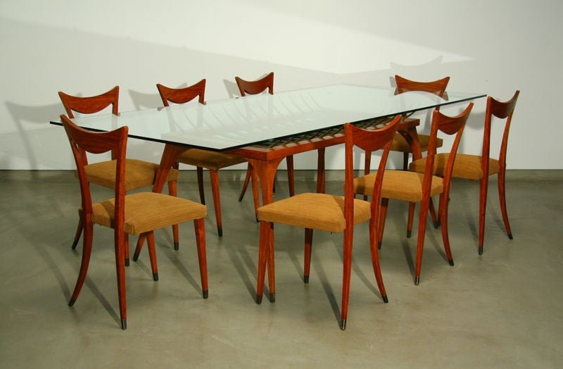 This unique dining table has a skeletal bronze spike structure that surges from an exotic wood base. This table was purchased in Sao Paolo Brasil and can be paired with a different size glass top.

Many pieces are stored in our warehouse, so