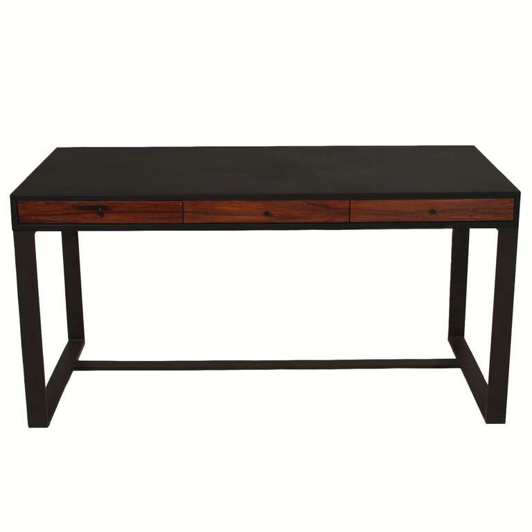 A black leather wrapped desk by Thomas Hayes Studio, with three Rosewood drawers and a frame of flat black finished solid steel base.  Desk is VERY heavy and sturdy. Drawers have soft close hardware and glide well.  

Price is COL, customer's own