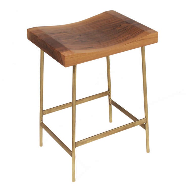 A custom version of the Bunda Stool by Thomas Hayes Studio with solid brass frames and hand-carved solid Walnut seats in counter height. Also available in bar height. 

Please look at all pictures, as these stools are individually handmade and the