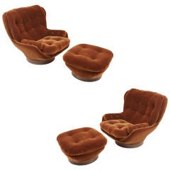 Pair of large brown mohair swivel lounge chairs and ottomans