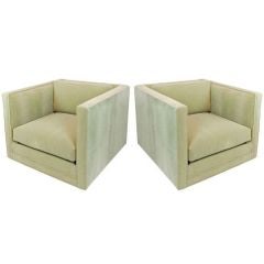 Pair of large square swivel arm chairs in pale green mohair
