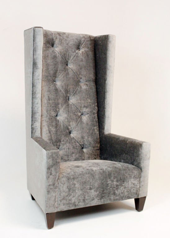 A gloriously high backed arm chair upholstered in lush gray tufted velvet with wood feet. This is an original Hollywood regency ridiculous chair.
Many pieces are stored in our warehouse, so please give us a call at (323) 463-4434 or email us at