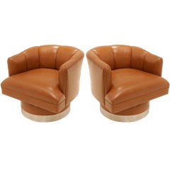 Pair of caramel leather chrome base swivel chairs