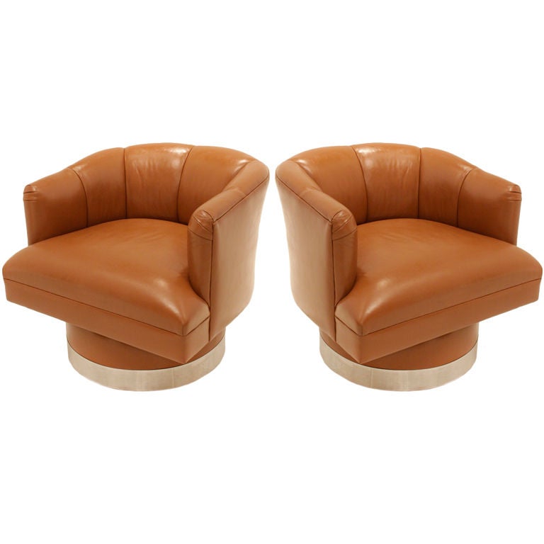 Pair of caramel leather chrome base swivel chairs at 1stDibs