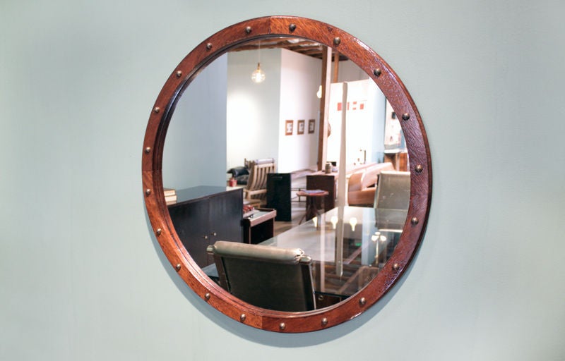 A lovely round mirror in brauna hardwood with a sculpted edge and adorned with patinated bronze half circles. Priced individually. This mirror is also available with polished brass half circles:
These mirrors were purchased from a hotel in San Paolo